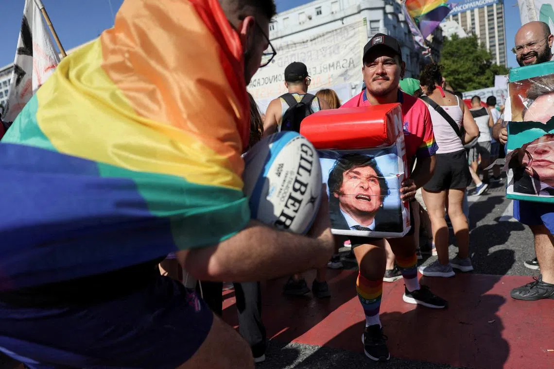 FILE PHOTO: Demonstrators march in support of the LGBT community to protest against Argentina's President Javier Milei's statement at the World Economic Forum saying that \"gender ideology\" is \"child abuse\", in Buenos Aires, Argentina, February 1, 2025. REUTERS/Cristina Sille/File Photo
