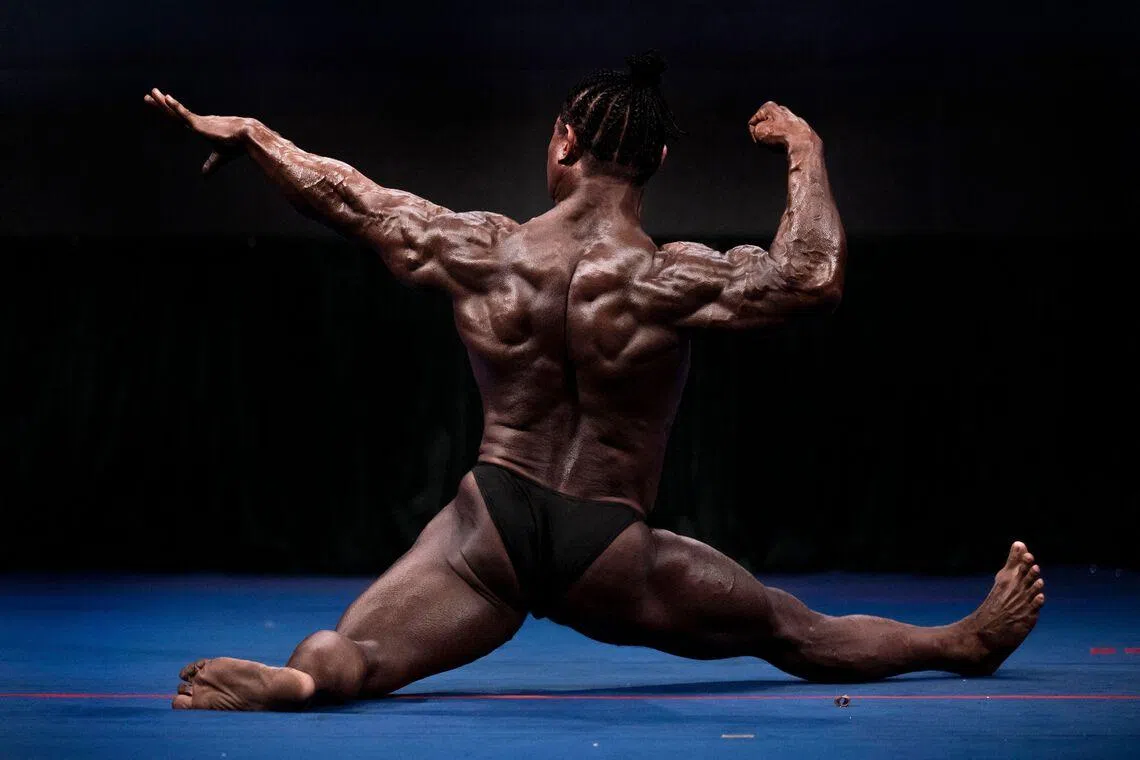 A bodybuilder flexing his muscles during the 20th South East Asian Championships 2026 at the Myanmar Convention Center in Yangon, Myanmar on May 16, 2026. 