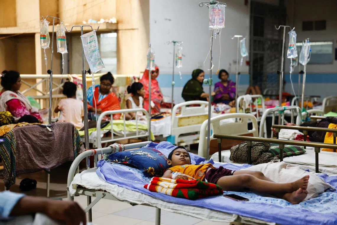 A dengue infected child lies on a bed after getting hospitalised for treatment at Mugda Medical College and Hospital, as the yearly death toll from the disease has surpassed the previous record in the country, in Dhaka, Bangladesh, Sept 5.