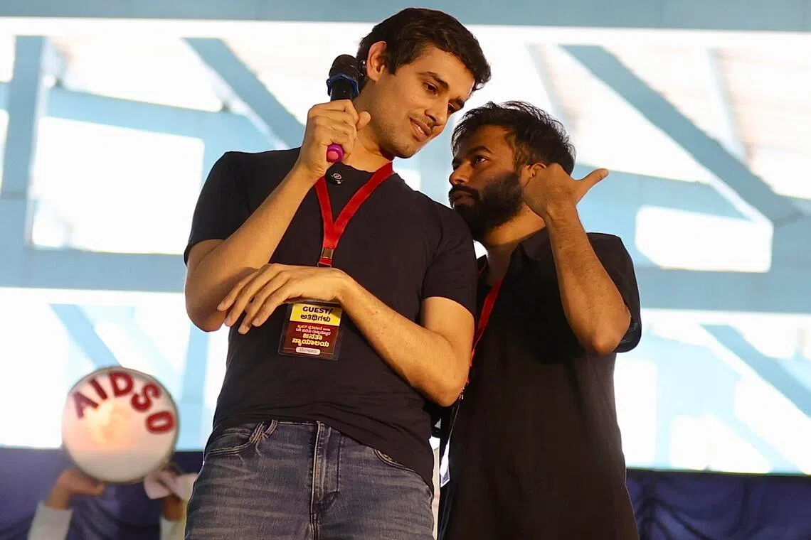 YouTube influencer and political commentator Dhruv Rathee (left) and Cockroach Janta Party founder Abhijeet Dipke participate in a protest against the central government over voter-list revisions in Bangalore, India, on Oct 8.