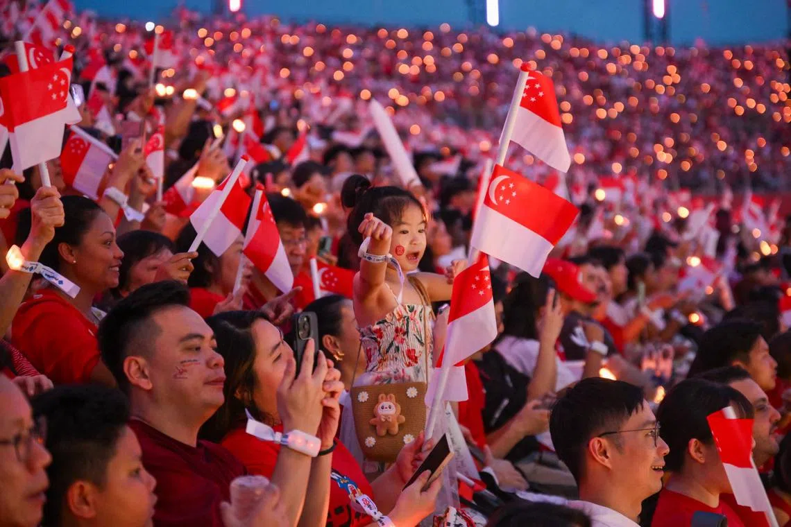 Spectators at the National Day Parade at the Padang on Aug 9.