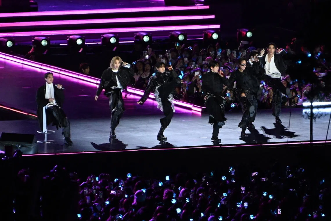 BTS performing onstage during their concert at Gwanghwamun Square in Seoul on March 21.