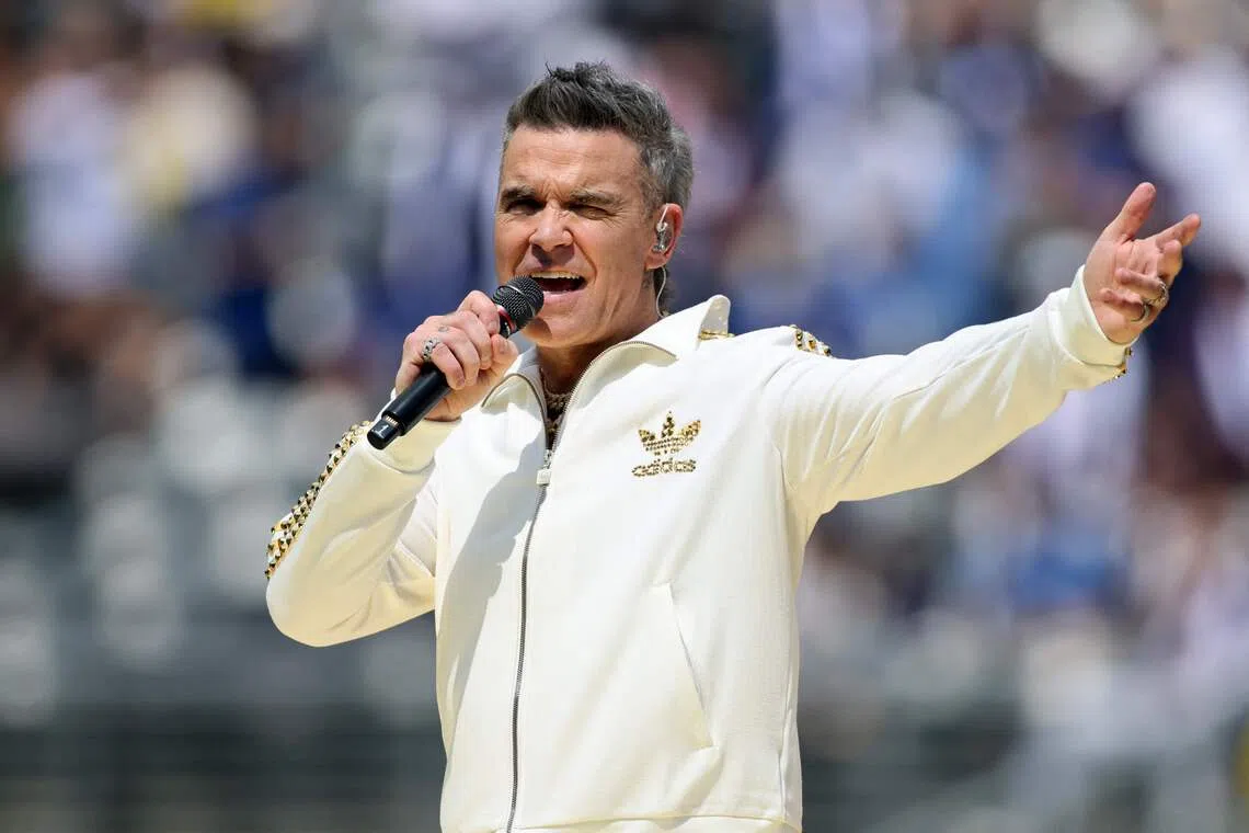Two Bulgarian transport inspectors have been sacked for demanding bribes from British pop star Robbie Williams’s tour convoy.