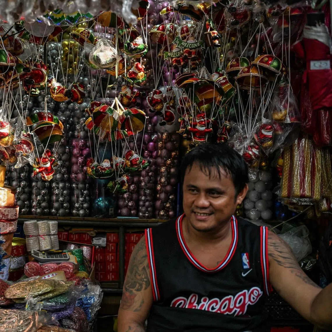 A vendor selling Christmas decorations at Divisoria market in Manila.