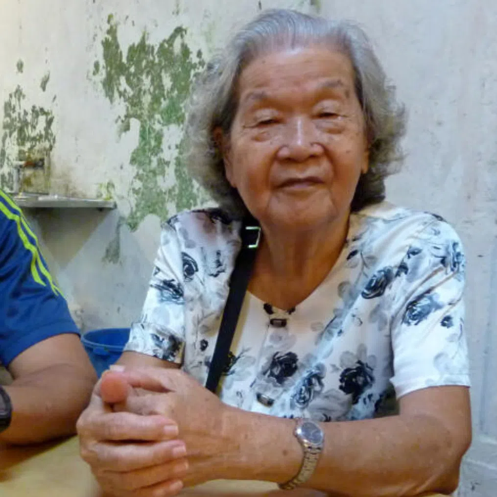 The writer with his grandmother. Their daily chats when she was alive were in Teochew, a language now he has trouble speaking.