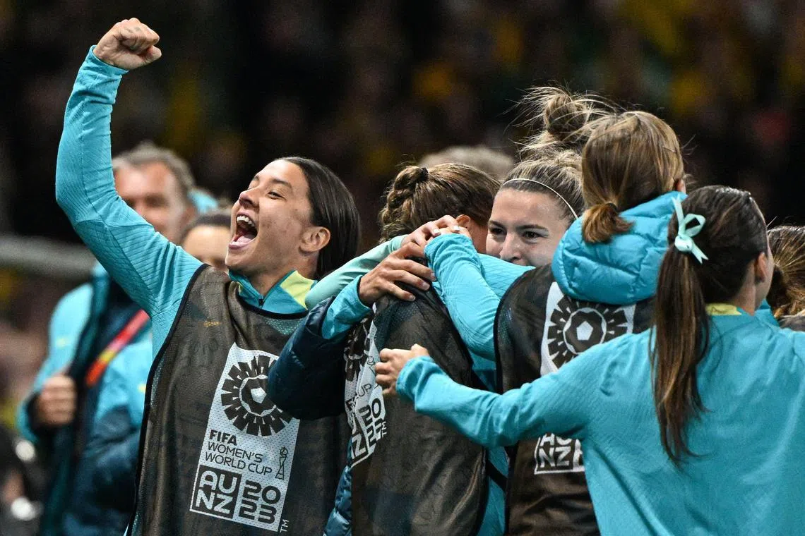 Australia forward Sam Kerr (far left) celebrating after Stephanie Catley (unseen) scored her team's fourth goal from the penalty spot during their 4-0 win over Canada at Melbourne Rectangular Stadium last Monday.