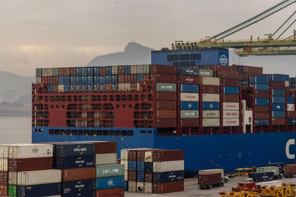 A container ship docked at the Port of Rio de Janeiro in Rio de Janeiro, Brazil, on Thursday, July 10, 2025. Donald Trump's threat to impose 50% tariffs on Brazilian goods sent the country's currency plunging as the US leader sharply escalated a dispute with Latin America's largest nation and leftist leader Luiz Inacio Lula da Silva. Photographer: Dado Galdieri/Bloomberg