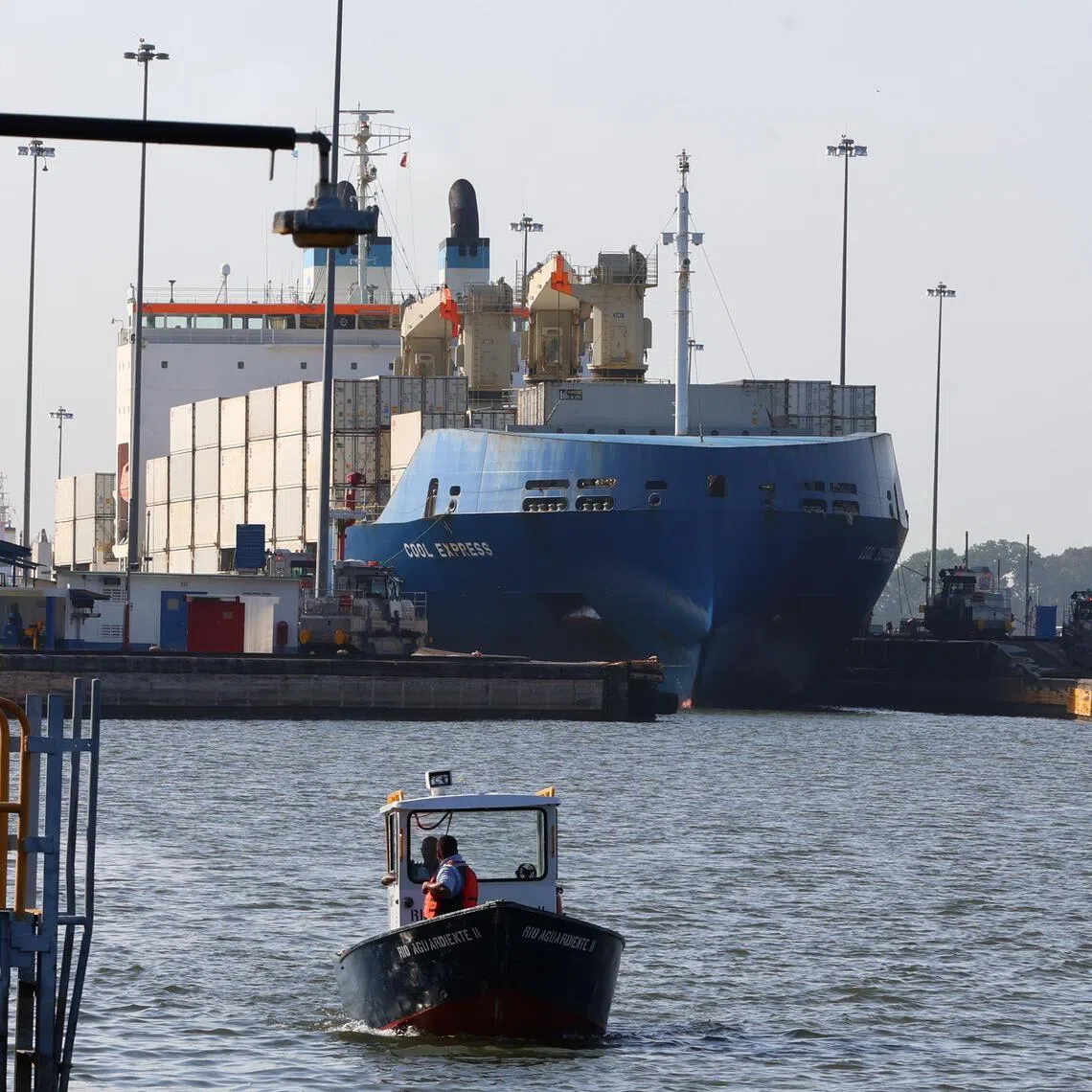 A container ship transits the Panama Canal in Panama City on Aug 19. Demand to urgently pass through the waterway has soared after the Iran war upended global trade routes.
