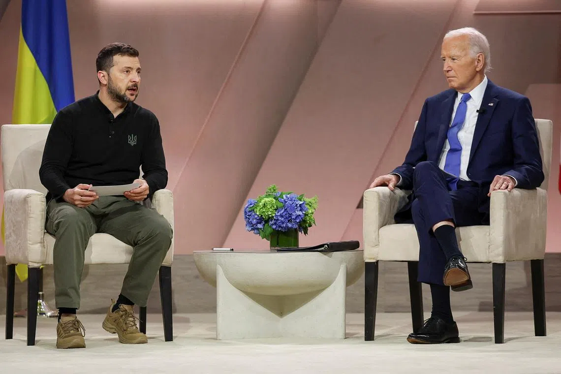 FILE PHOTO: U.S. President Joe Biden and Ukraine's President Volodymyr Zelenskiy attend a bilateral meeting, during NATO's 75th anniversary summit, in Washington, U.S., July 11, 2024. REUTERS/Leah Millis/File Photo