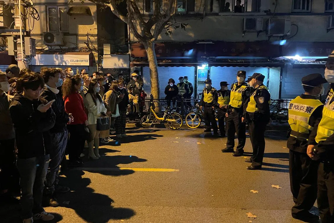 People protesting against Covid-19 curbs in Shanghai on Nov 27, days after a deadly fire apartment in Xinjiang.