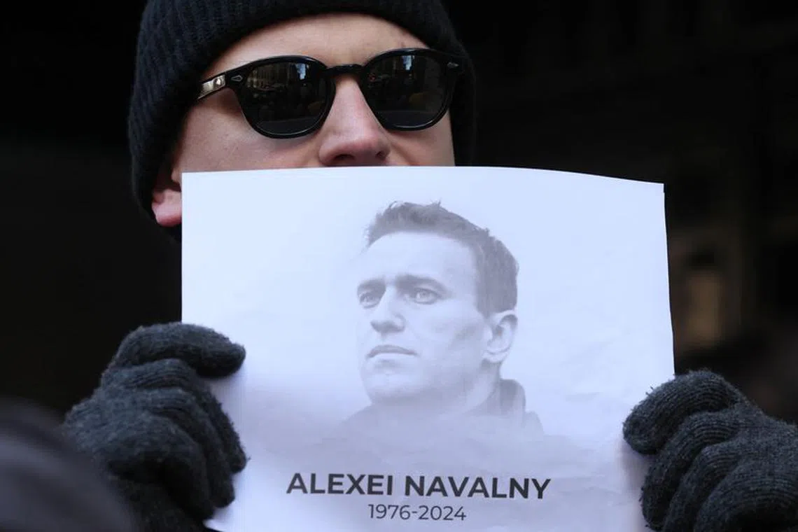 People attend a vigil after the death of Alexei Navalny, outside the Russian consulate in New York City, U.S., February 16, 2024.   REUTERS/Brendan McDermid