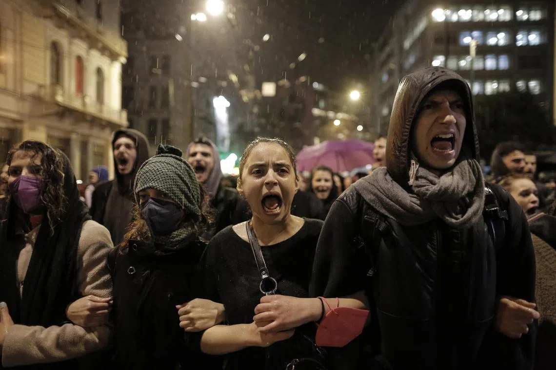 People shout slogans during a protest march in Athens, Greece, over a deadly train crash that killed 57 people, on March 2, 2023. 
