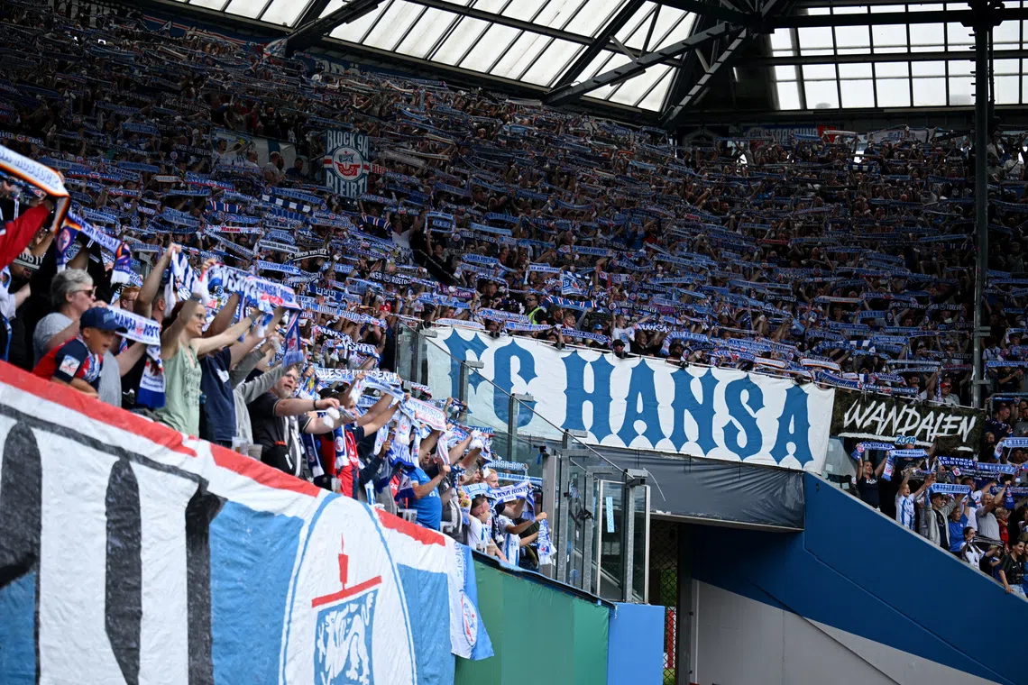 FILE PHOTO: Soccer Football - DFB Cup - First Round - Hansa Rostock v Hertha BSC - Ostseestadion, Rostock, Germany - August 18, 2024 Hansa Rostock fans inside the stadium before the match REUTERS/Annegret Hilse/ File Photo