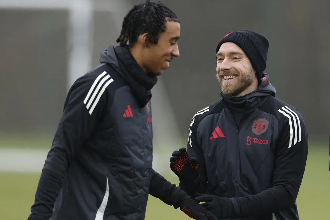 FILE PHOTO: Soccer Football - Europa League - Manchester United Training - Trafford Training Centre, Carrington, Britain - January 22, 2025 Manchester United's Leny Yoro and Christian Eriksen during training Action Images via Reuters/Jason Cairnduff/File Photo