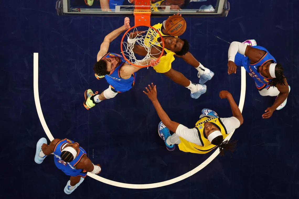 Indiana Pacers guard Bennedict Mathurin shoots the ball against Oklahoma City Thunder forward Chet Holmgren during Game 3.