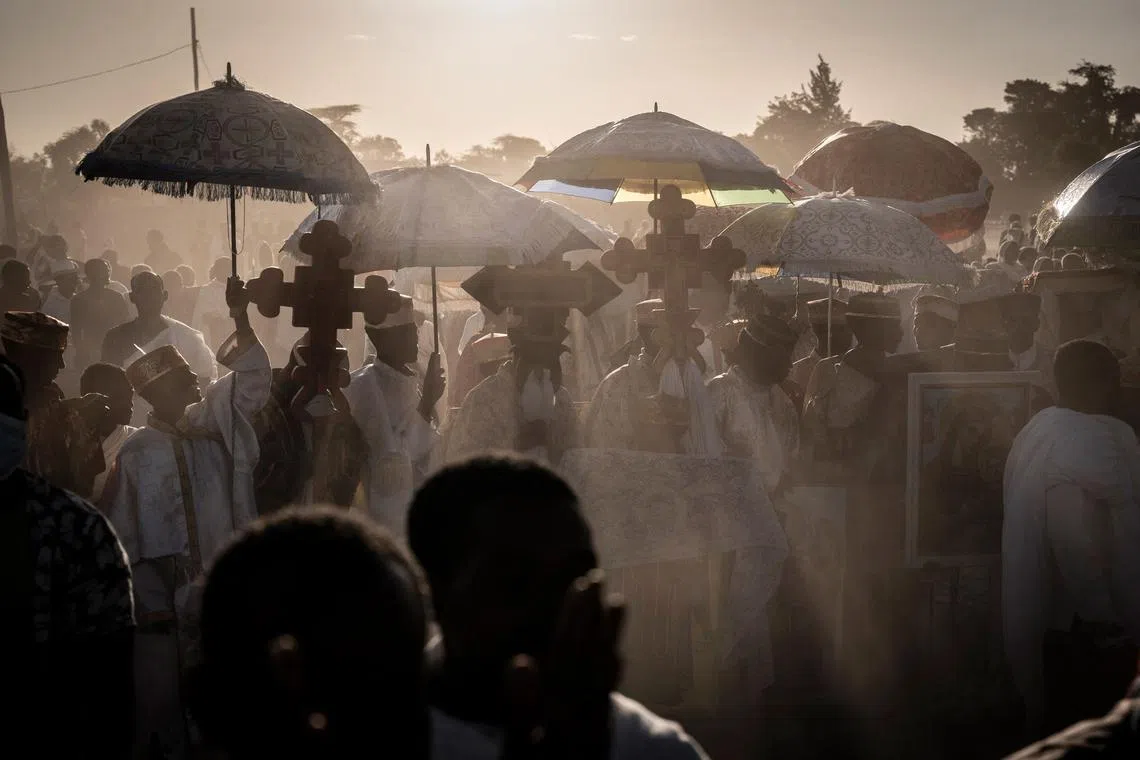 High priests celebrate timkat (Ethiopian Epiphany) on lake Batu, Ethiopia, on Jan 18, 2023. 