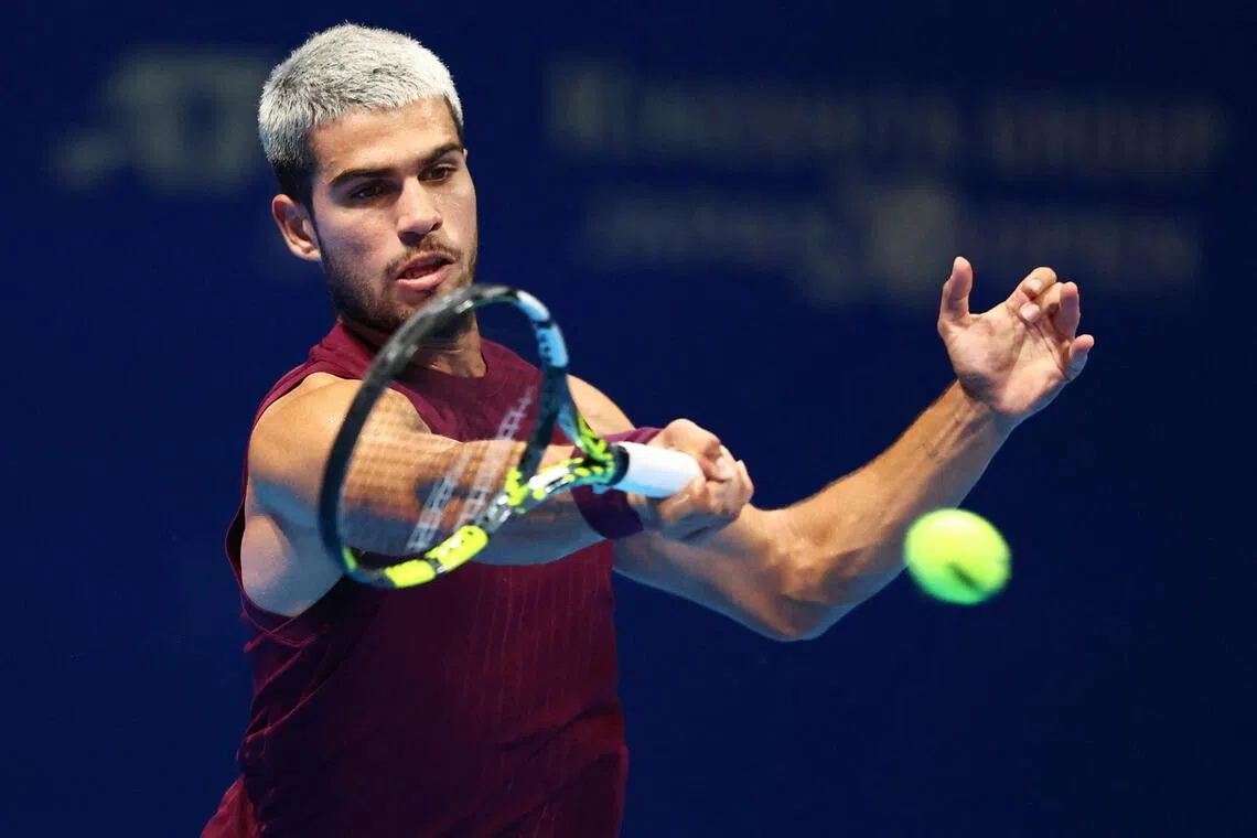 Spain's Carlos Alcaraz in action during the Japan Open final against Taylor Fritz of the US.