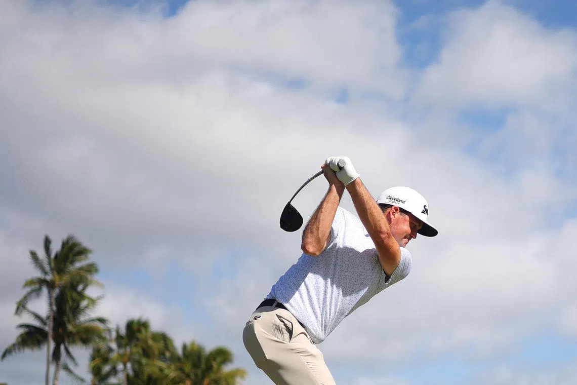 Keegan Bradley of the United States playing his shot from the tenth tee during the third round of the Sony Open in Hawaii at Waialae Country Club on Jan 13. He has a share of the third-round lead, alongside Grayson Murray on 14-under 196.