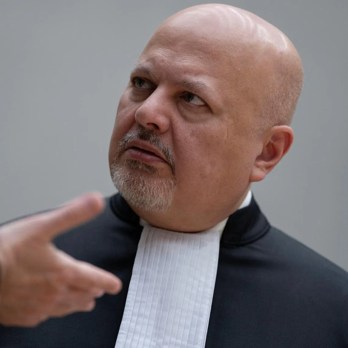 Chief Prosecutor Karim Khan talks while waiting for former Philippine President Rodrigo Duterte to appear via video link before the International Criminal Court (ICC), in The Hague, Netherlands, Friday, March 14, 2025.     Peter Dejong/Pool via REUTERS