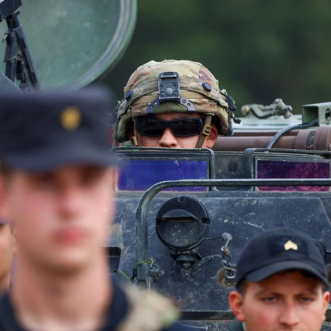 A US Army soldier looking out from an M113 armoured personal carrier during A NATO training exercise in Germany on Aug 26.
