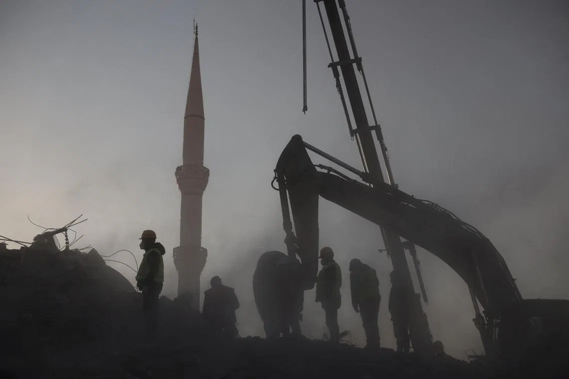 Rescuers work on the rubble of a collapsed building in the aftermath of a deadly earthquake in Kahramanmaras, Turkey February 14, 2023. 
