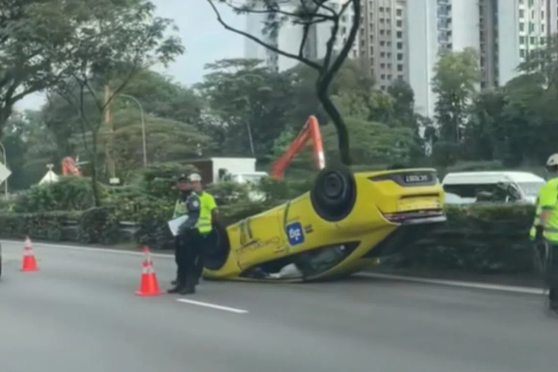 Cabby and passenger taken to hospital after PIE accident causes ComfortDelGro taxi to overturn