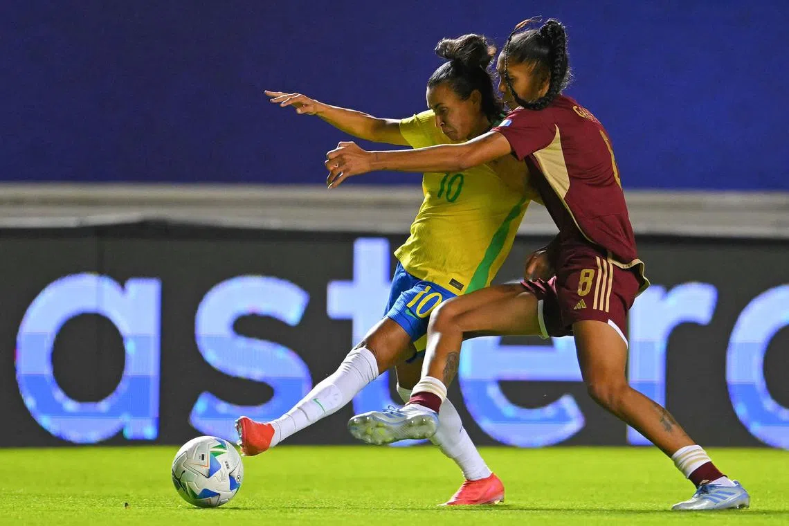 Brazil forward Marta Vieira shielding the ball from Venezuela midfielder Gabriela Garcia fight for the ball in the Women's Copa America football match at the Gonzalo Pozo Ripalda Stadium in Quito on July 13, 2025.