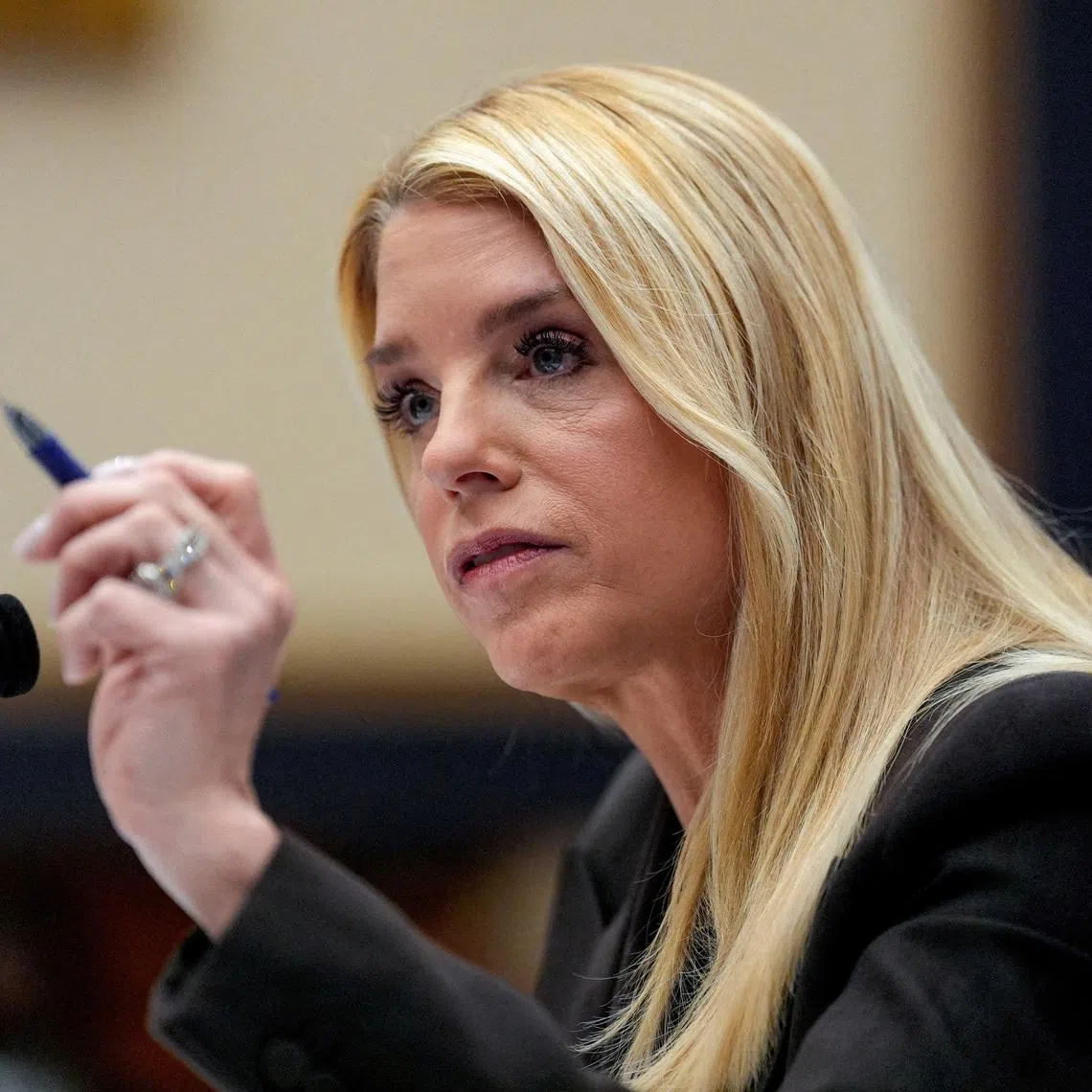 FILE PHOTO: U.S. Attorney General Pam Bondi testifies before a House Judiciary Committee hearing on oversight of the Justice Department, on Capitol Hill in Washington, D.C., U.S., February 11, 2026. REUTERS/Kent Nishimura/File Photo
