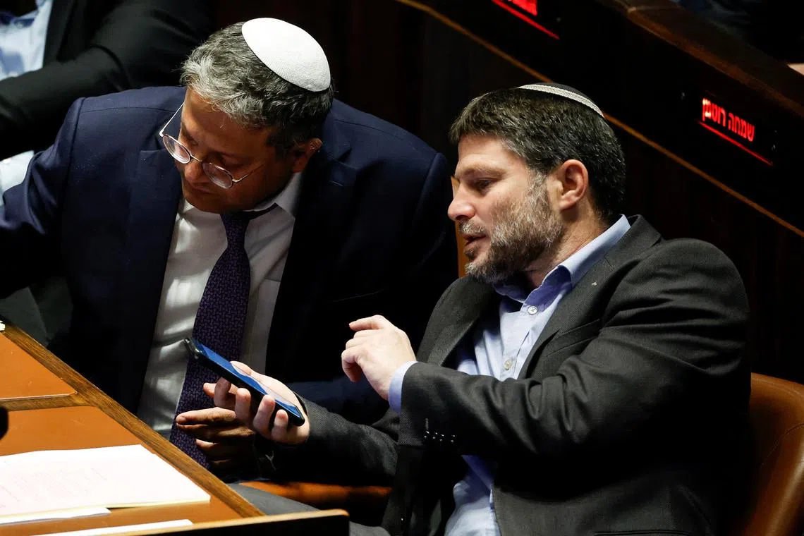 Israeli right-wing Knesset members Itamar ben Gvir and Bezalel Smotrich attend a plenum session in Jerusalem on Dec 28, 2022.