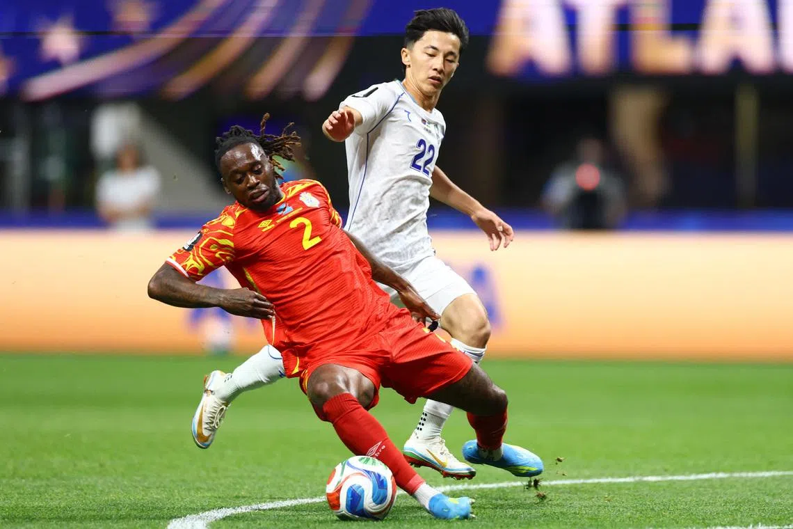 Soccer Football - FIFA World Cup 2026 - Group K - DR Congo v Uzbekistan - Atlanta Stadium, Atlanta, Georgia, U.S. - June 27, 2026 DR Congo's Aaron Wan Bissaka in action with Uzbekistan's Abbosbek Fayzullaev REUTERS/Claudia Greco