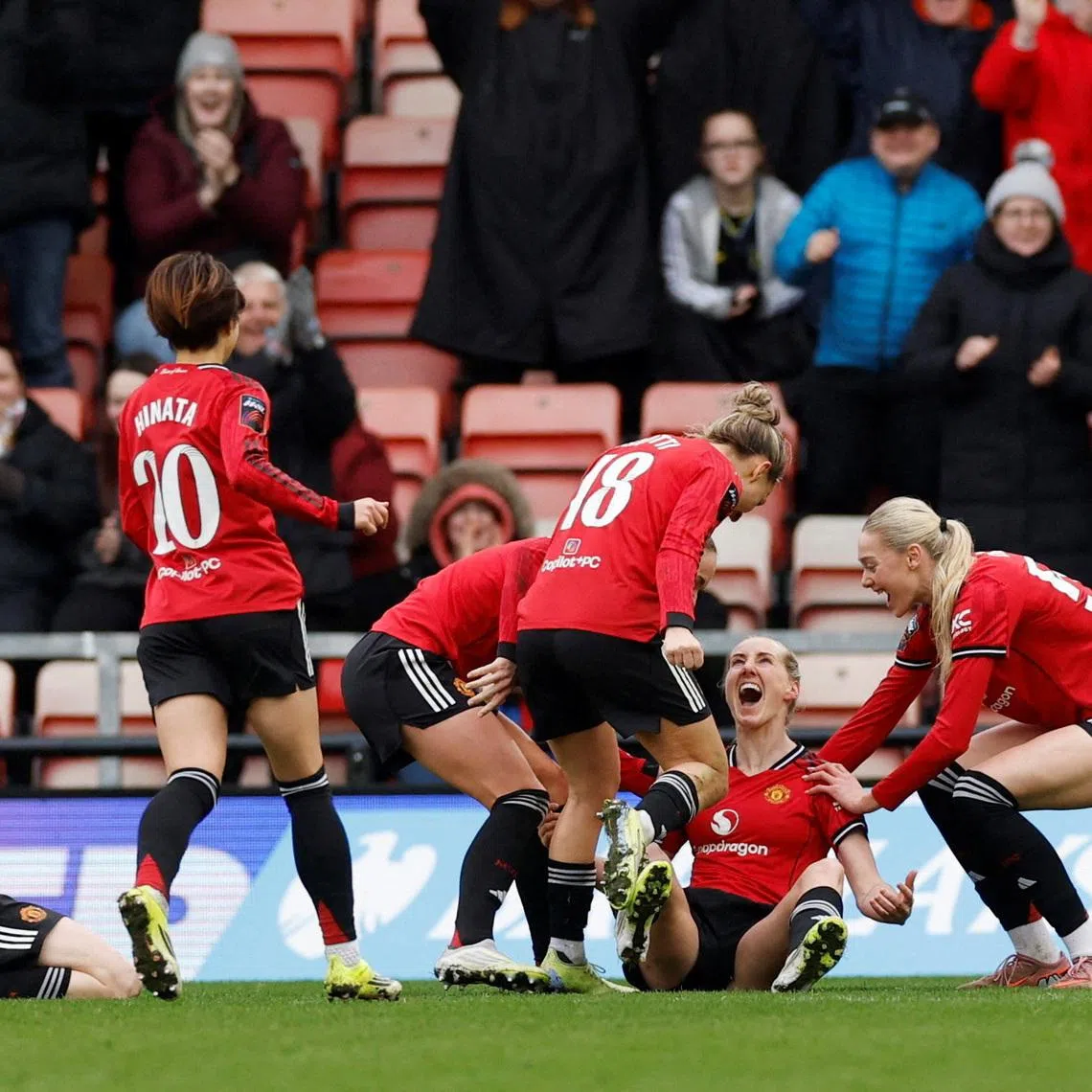 Soccer Football - Women's Super League - Manchester United v London City Lionesses - Leigh Sports Village, Leigh, Britain - February 15, 2026 Manchester United's Millie Turner celebrates scoring their second goal with teammates Action Images via Reuters/Jason Cairnduff