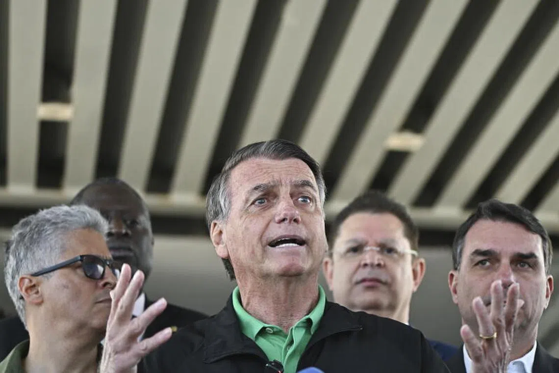 epa12243402 Former Brazilian president Jair Bolsonaro (C) speaks during a press conference in front of the Federal Senate in Brasilia, Brazil, 17 July 2025. Bolsonaro stated that he will 'face the trial' that has him as the main defendant for orchestrating an alleged coup attempt after losing the 2022 elections. Bolsonaro is accused of planning a coup attempt to stay in power after the 2022 presidential elections. EPA/Andre Borges