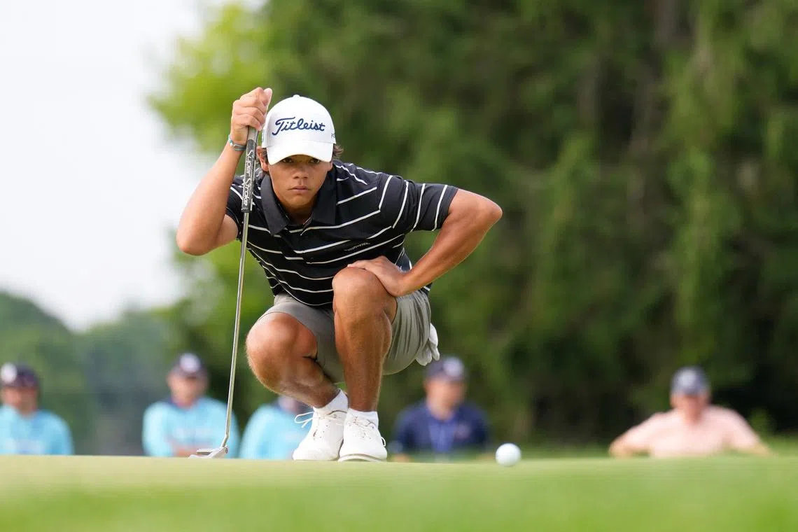 Charlie Woods of the United States lines up his putt on the first hole on day one on the North Course.
