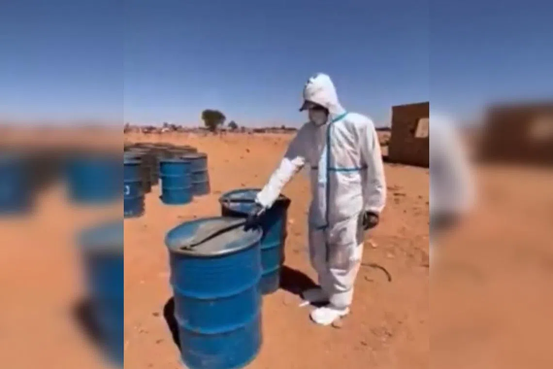 Gen Khaled al-Mahjoub published a video showing a man in a protective suit counting 18 blue containers, the total that had been stored at the site.