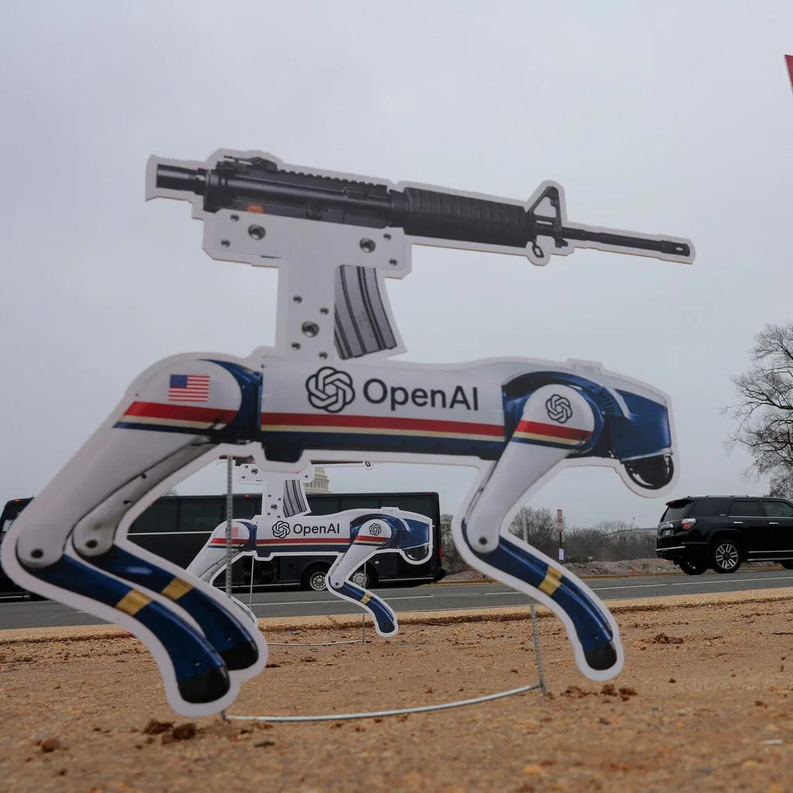 Signs featuring robot dogs are planted on the National Mall in Washington as an act of protest against OpenAI’s decision to allow the Pentagon to use its technologies.