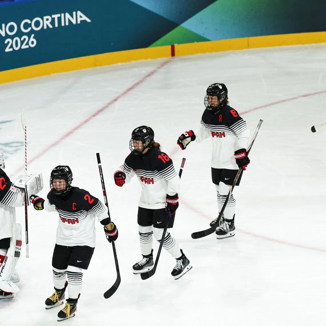 Milano Cortina 2026 Olympics - Ice Hockey - Women's Preliminary Round - Group B - France vs Japan - Milano Rho Ice Hockey Arena, Milan, Italy - February 06, 2026. Japan players celebrate after Makoto Ito of Japan scores their second goal. REUTERS/Mike Segar