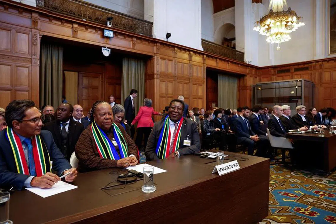 South Africa's Department of International Relations and Cooperation (DIRCO) Director-General Zane Dangor, South African Foreign Minister Naledi Pandor and South African Ambassador to the Netherlands Vusimuzi Madonsela sit on the day the International Court of Justice (ICJ) rule on emergency measures against Israel following accusations by South Africa that the Israeli military operation in Gaza is a state-led genocide, in The Hague, Netherlands, January 26, 2024. REUTERS/Piroschka van de Wouw