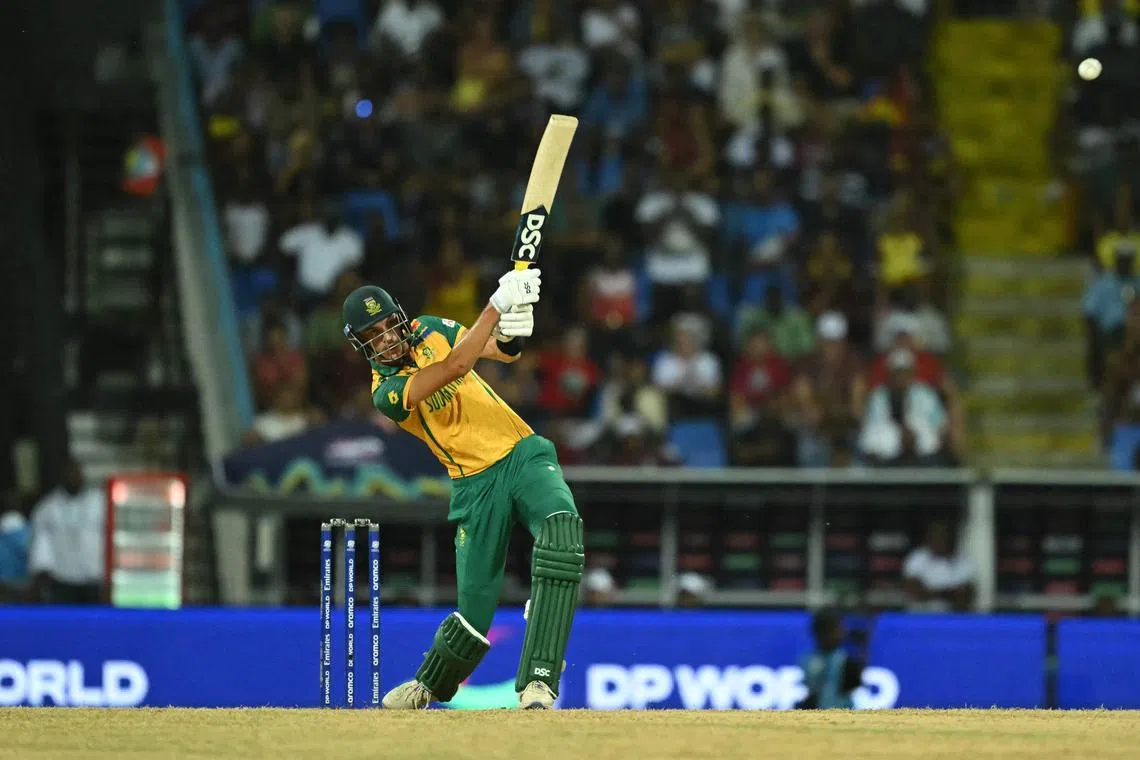 South Africa's Marco Jansen hits a six that gives his team victory over the West Indies in their ICC men's Twenty20 World Cup 2024 Super Eight cricket match at Sir Vivian Richards Stadium in North Sound, Antigua and Barbuda on June 23, 2024.
