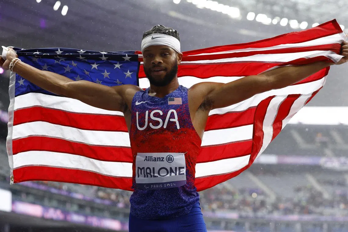 Noah Malone of the United States celebrating after finishing second to Morocco's Mouncef Bouja in the T12 400 metres in a time of 49.35 seconds. 