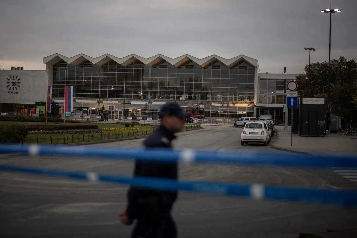 FILE PHOTO: A Police officer secures the perimeter of a railway station, where people died when a part of the roof collapsed, in Novi Sad, Serbia November 2, 2024. REUTERS/Marko Djurica/File Photo