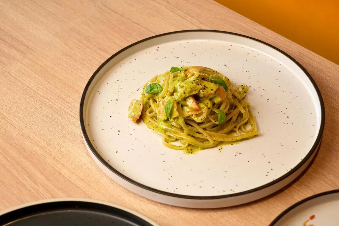 Linguine tossed with Smoked Salmon in Cream Pesto Sauce from Acqua e Farina.