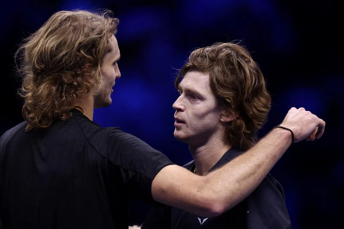 FILE PHOTO: Tennis - ATP Finals Turin - Pala Alpitour, Turin, Italy - November 17, 2023 Germany's Alexander Zverev with Russia's Andrey Rublev after winning his group stage match REUTERS/Guglielmo Mangiapane/File Photo