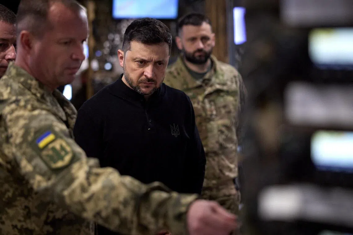 Ukrainian President Volodymyr Zelensky visiting soldiers on the front line in Ukraine's Zaporizhzhia region, on Nov 13.