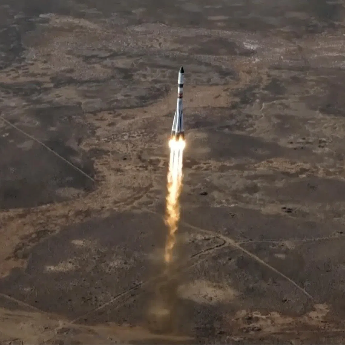 A Soyuz-2.1a rocket booster with a Progress MS-33 cargo spacecraft blasts off to the International Space Station (ISS) from the launch pad at the Baikonur Cosmodrome, Kazakhstan March 22, 2026, in this still image taken from video. Roscosmos/Handout via REUTERS