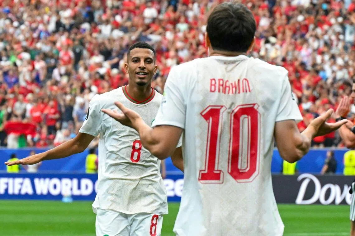 Azzedine Ounahi celebrating with Brahim Diaz after scoring Morocco’s second goal during their 3-0 World Cup last-16 win over Canada at NRG Stadium in Houston on July 4.