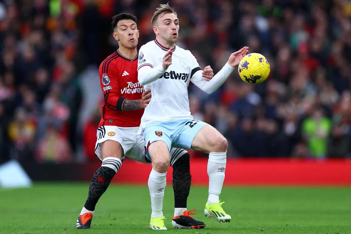 Soccer Football - Premier League - Manchester United v West Ham United - Old Trafford, Manchester, Britain - February 4, 2024 Manchester United's Lisandro Martinez in action with West Ham United's Jarrod Bowen REUTERS/Carl Recine/File Photo