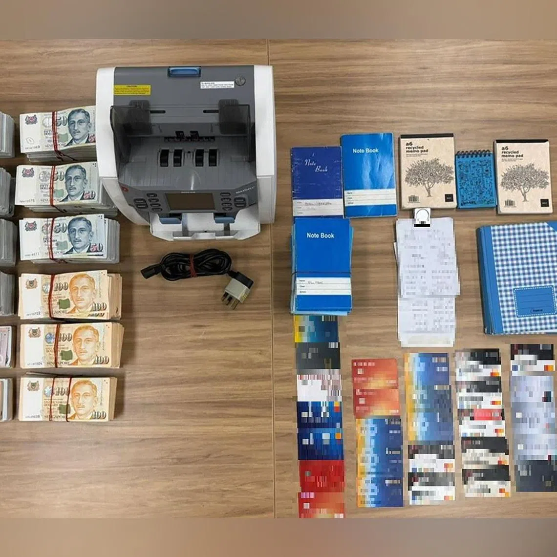 More than $314,000 in cash and 30 ATM cards were seized, among other items, during a raid of the operations on April 8.