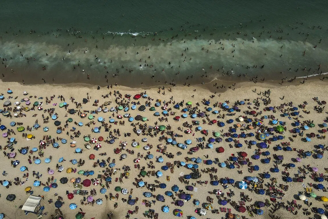 Beachgoers sunbathing at Ipanema beach in Rio de Janeiro, Brazil on Aug 24.