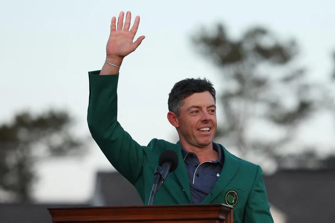 Golf - The Masters - Augusta National Golf Club, Augusta, Georgia, U.S. - April 13, 2025 Northern Ireland's Rory McIlroy celebrates with his green jacket after winning The Masters and completing a career grand slam REUTERS/Pilar Olivares