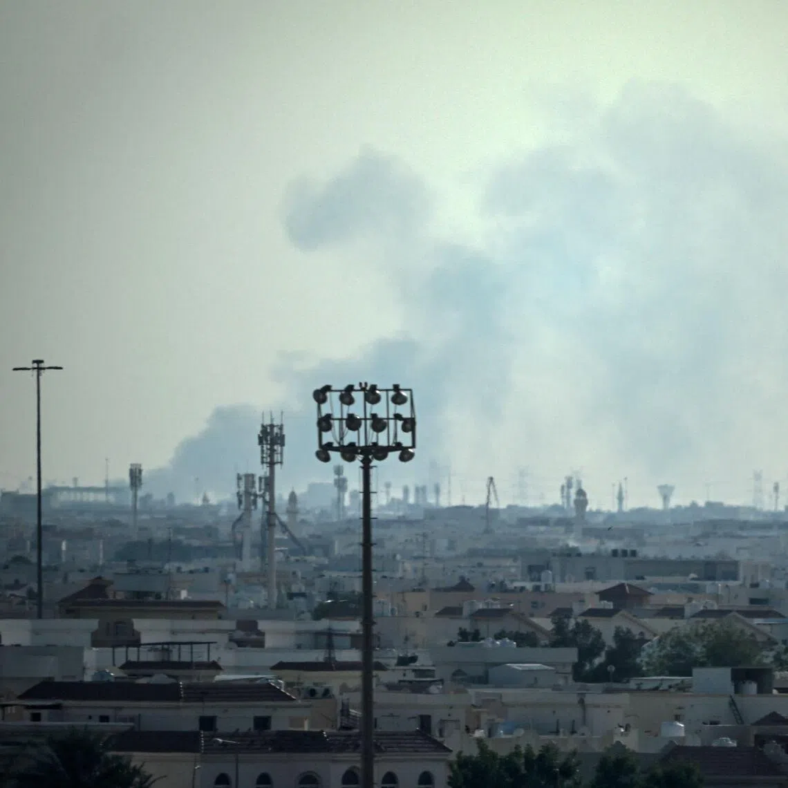 Smoke rising from an area in the direction of Qatar's Al Udeid Air Base, which houses the Qatar Emiri Air Force and foreign forces including the US, in Doha on Feb 28.